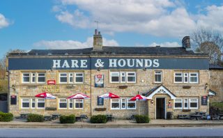 A pub with umbrellas outside