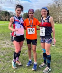 3 women with race medals